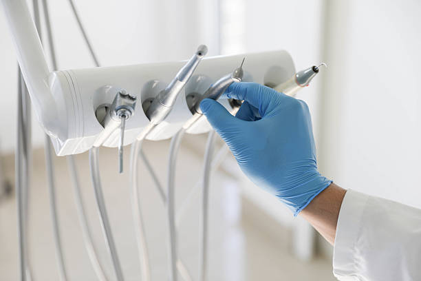 Professional Tooth Extraction technician working in Cave Springs, AR